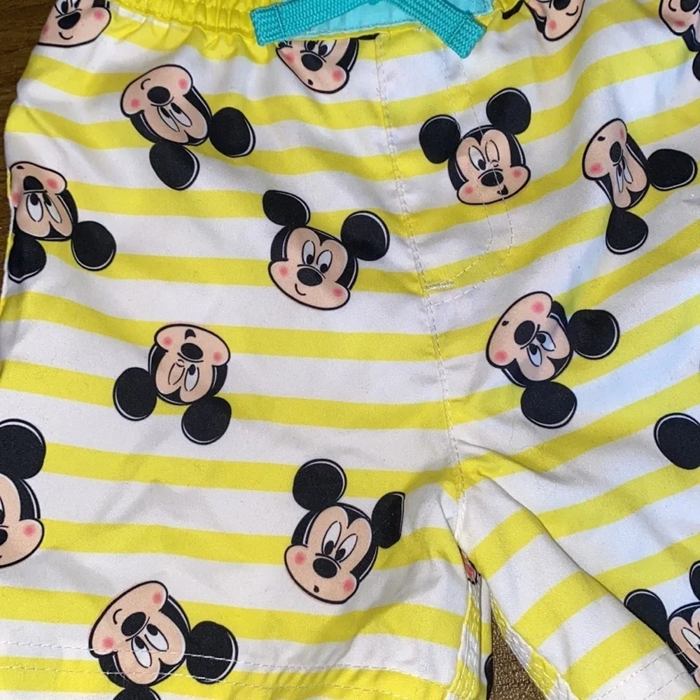 NWT Disney swim trunks size 9-12M